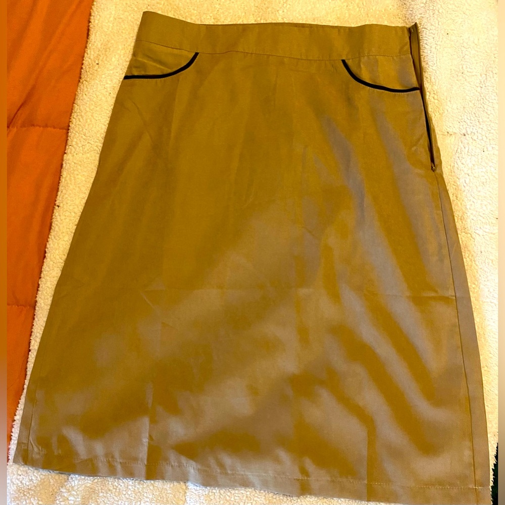 A-line khaki skirt. Size medium. Runs small.